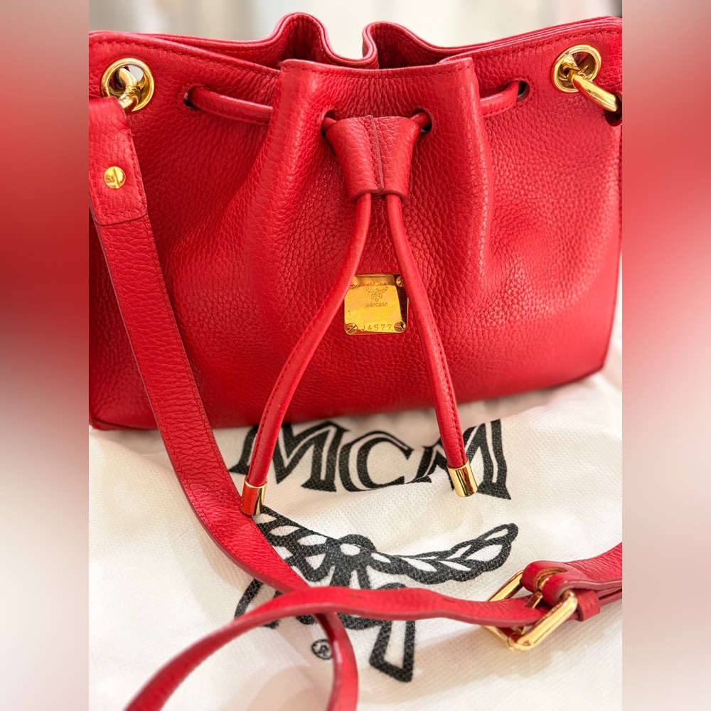 MCM Red Leather Bucket Bag
Crossbody Drawstring Gold Hardware - Picture 4 of 17